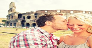 A couple iat the  Rome Colosseum